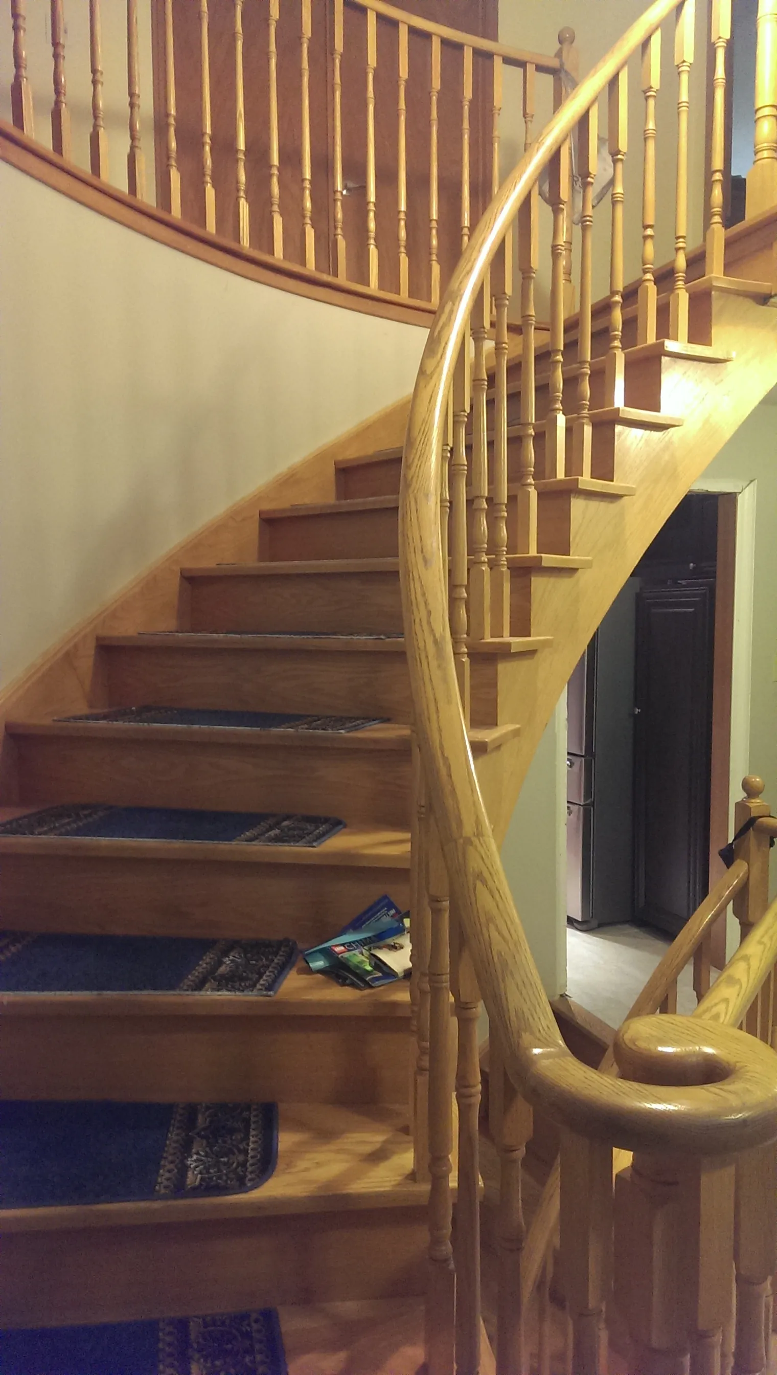 Natural Hardwood Staircase Leading to Second Floor